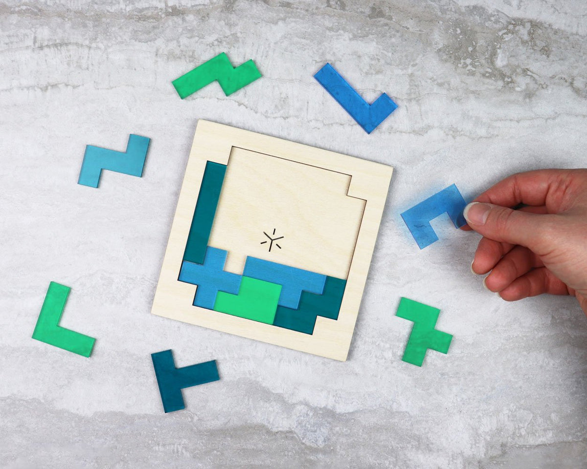 Earth square pentomino puzzle in packaging