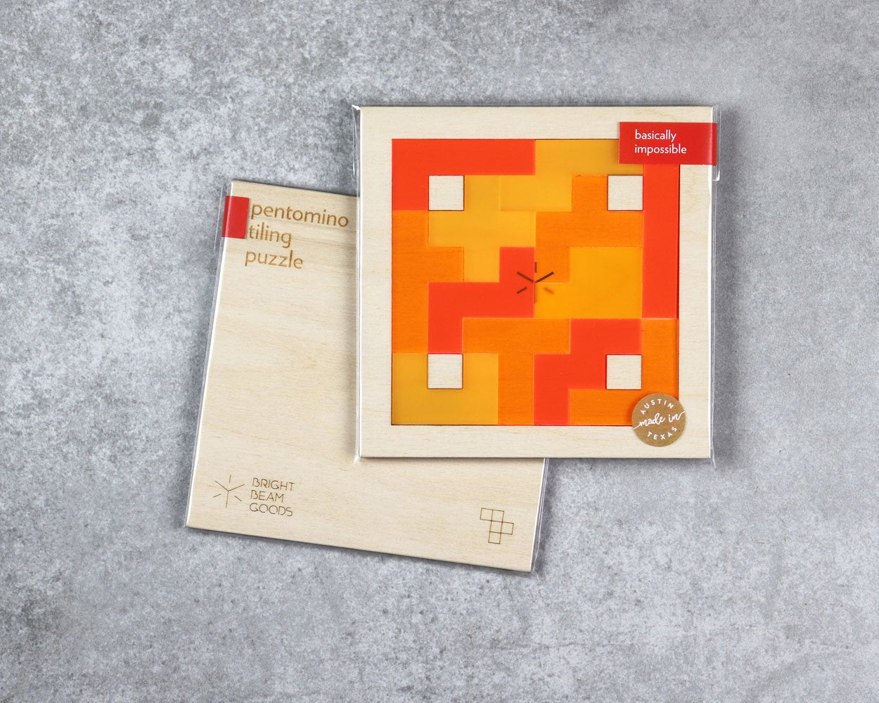 Flame square pentomino puzzle in packaging